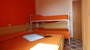 a room with two bunk beds with a laptop on it at Residence Holiday in Bellaria-Igea Marina