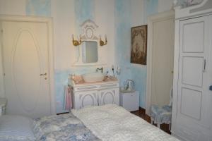 Postel nebo postele na pokoji v ubytování B&B La Maison degli Angeli