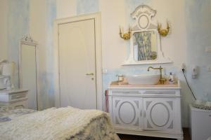 Postel nebo postele na pokoji v ubytování B&B La Maison degli Angeli