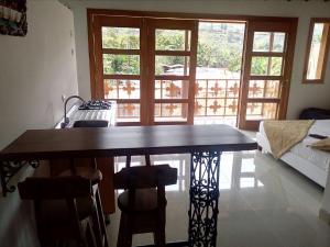 a dining room with a table and some chairs at Jardín Amoblados in Jardin