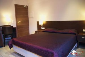 Postel nebo postele na pokoji v ubytování Hotel il Castello Borghese