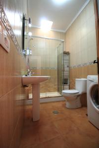 a bathroom with a sink and a toilet and a shower at MONTAÑA VALLES DE ORTEGA - A in Valles de Ortega