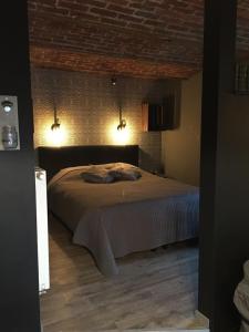 Gîte de Corbion loft2客房内的一张或多张床位