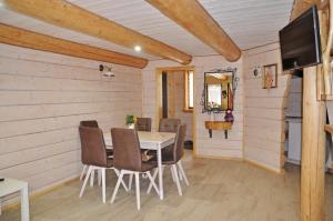 a dining room with a table and chairs at Provence in Slavske