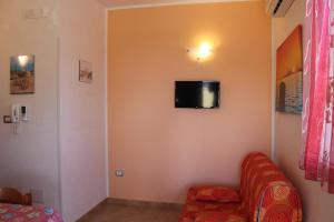 TV a/nebo společenská místnost v ubytování Residence Jonico