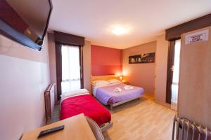 Letto o letti in una camera di Hotel Albi