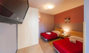 Posteľ alebo postele v izbe v ubytovaní Hotel Albi