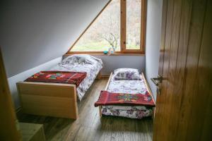 Voodi või voodid majutusasutuse Country House Selo toas