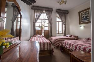 Postel nebo postele na pokoji v ubytování Hotel Plaza del Teatro