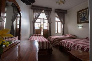 Postel nebo postele na pokoji v ubytování Hotel Plaza del Teatro