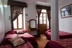 Postel nebo postele na pokoji v ubytování Hotel Plaza del Teatro