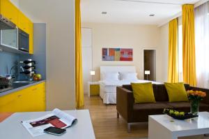 Postel nebo postele na pokoji v ubytování Mamaison Residence Sulekova Bratislava
