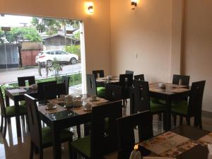 Ресторант или друго място за хранене в Tariri Hotel