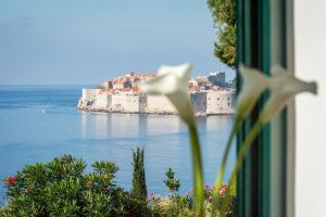 a view of a city from a window at Room St. Jacob Dubrovnik in Dubrovnik
