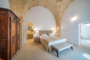 Letto o letti in una camera di Castello di Ugento