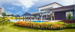 a house with a swimming pool in front of it at Sky breeze haven in Tagaytay