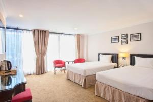 Voodi või voodid majutusasutuse Dinh Ami Hanoi Hotel toas