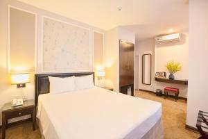 Voodi või voodid majutusasutuse Dinh Ami Hanoi Hotel toas