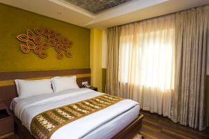 Letto o letti in una camera di Bodhi Boutique Hotel