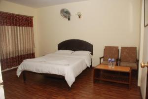 Postel nebo postele na pokoji v ubytování Kathmandu Madhuban Guest House