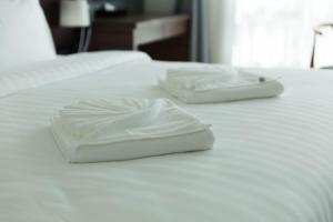 Postel nebo postele na pokoji v ubytování Avada Hotel
