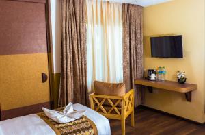 Letto o letti in una camera di Bodhi Boutique Hotel