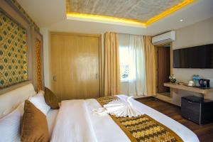 Letto o letti in una camera di Bodhi Boutique Hotel