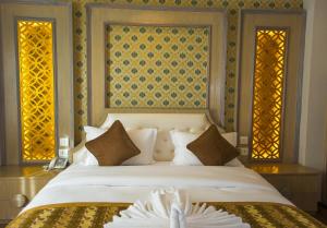 Letto o letti in una camera di Bodhi Boutique Hotel