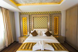Letto o letti in una camera di Bodhi Boutique Hotel