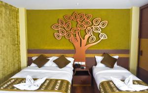 Letto o letti in una camera di Bodhi Boutique Hotel