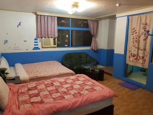 Tempat tidur dalam kamar di San Ho Hotel