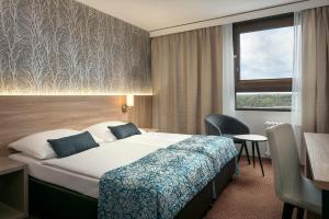 Posteľ alebo postele v izbe v ubytovaní Congress & Wellness Hotel Olsanka