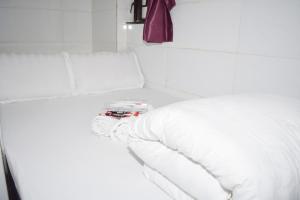 Voodi või voodid majutusasutuse Pay-Less Guesthouse (7/F A9) toas