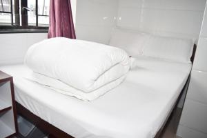 Voodi või voodid majutusasutuse Pay-Less Guesthouse (7/F A9) toas