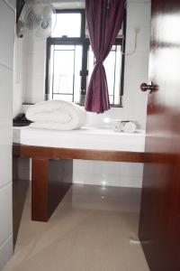 Koupelna v ubytování Pay-Less Guesthouse (7/F A9)
