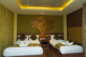 Letto o letti in una camera di Bodhi Boutique Hotel
