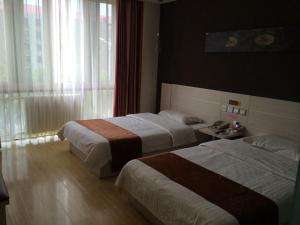 En eller flere senger på et rom på Thank Inn Chain Hotel Hebei Cangzhou West Jiefang Road