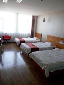 a hotel room with three beds in a room at Thank Inn Chain Hotel Hebei Cangzhou Dongwaihuan International Hardware Plaza in Cangzhou