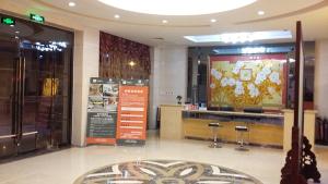 a store lobby with a large screen in a building at JUNYI Hotel Hebei Hengshui Shenzhou Government Building in Shen