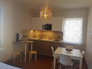 a kitchen with a table and chairs and a dining room at La Terrazza in Spoleto