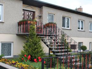 a house with a staircase on the side of it at Peaceful Apartment in Klutz Germany near Boltenhagener Beach in Klütz