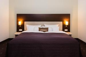 Postel nebo postele na pokoji v ubytování Hotel Esplanade Dortmund