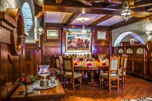 a large dining room with a table and chairs at Hotel Kapitany Wellness in Sümeg