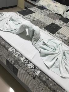 Säng eller sängar i ett rum på Varanda Hotel