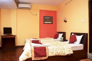 Letto o letti in una camera di Kathmandu Eco Hotel