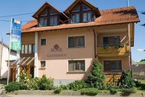 a building with a sign that reads rosie christians at Biohotel-Restaurant Rose in Hayingen