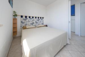 Postel nebo postele na pokoji v ubytování Deliziosi Appartamenti Sul Mare