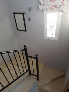 A bed or beds in a room at Villa - zeezicht, zwembad