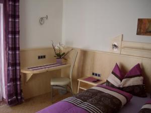 En eller flere senge i et værelse på Apartment Haus Millauer