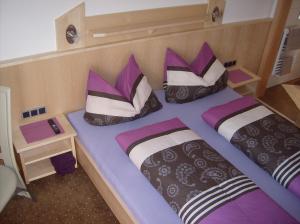 Кровать или кровати в номере Apartment Haus Millauer
